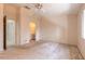 Large bedroom with a ceiling fan, neutral paint, carpet, and access to the bathroom and closet at 140 Limewood Pl # 2, Ormond Beach, FL 32174