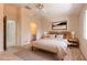 Relaxing bedroom with neutral tones, wood furniture, ensuite bathroom, and plush bedding at 140 Limewood Pl # 2, Ormond Beach, FL 32174