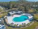 An aerial view of the kidney-shaped community pool, perfect for a refreshing swim or lounging by the water at 140 Limewood Pl # 2, Ormond Beach, FL 32174