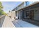A long wooden deck that goes from condo to condo with access to the interior from an outside screen door at 140 Limewood Pl # 2, Ormond Beach, FL 32174