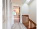 Hallway with carpet, white closet doors and wood trim at 140 Limewood Pl # 2, Ormond Beach, FL 32174