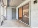 Outdoor patio with door leading into the house and overlooking an outdoor deck area at 140 Limewood Pl # 2, Ormond Beach, FL 32174