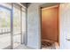 Outdoor patio with door leading to an outdoor deck area and door to a storage room at 140 Limewood Pl # 2, Ormond Beach, FL 32174