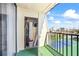 Balcony storage with sports equipment inside and a sunny view of the city and courts at 1441 N Atlantic Ave # 417, Daytona Beach, FL 32118