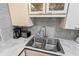 The kitchen is equipped with stainless steel appliances, granite countertops, and modern fixtures at 1441 N Atlantic Ave # 417, Daytona Beach, FL 32118