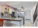 This kitchen features stainless steel appliances, light cabinets, and a breakfast bar area at 1441 N Atlantic Ave # 417, Daytona Beach, FL 32118