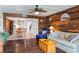 Cozy living room featuring unique wooden wall decor, comfortable seating, and access to the dining area at 1441 N Atlantic Ave # 417, Daytona Beach, FL 32118