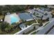 Aerial view of the community center with swimming pool, playground, parking area and pickleball courts at 1689 Lake Reserve Dr, Deland, FL 32724