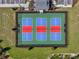 Overhead of pickleball courts with red and blue playing surfaces inside of a fenced area at 1689 Lake Reserve Dr, Deland, FL 32724