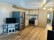 Spacious kitchen with stainless steel appliances and modern flooring at 212 Rue De Pont, Tavares, FL 32778