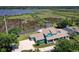 Stunning waterfront property features a spacious home, dock, and lush greenery at 2189 Old Dixie Hwy, Ormond Beach, FL 32174