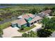Aerial view of waterfront home with large lot, attached garage and backyard screened pool at 2189 Old Dixie Hwy, Ormond Beach, FL 32174