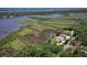 A waterfront property features lush landscaping near the river at 2189 Old Dixie Hwy, Ormond Beach, FL 32174
