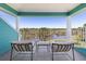 Covered balcony overlooking water and lush landscape, great for relaxing outdoors at 2189 Old Dixie Hwy, Ormond Beach, FL 32174