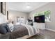 Comfortable bedroom featuring a doorway to an outdoor patio, and a work area with large screen monitor at 2189 Old Dixie Hwy, Ormond Beach, FL 32174