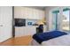 Bedroom has built-in desk and cabinets and balcony access at 2189 Old Dixie Hwy, Ormond Beach, FL 32174