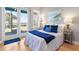 Comfortable bedroom with sliding glass door to the covered balcony at 2189 Old Dixie Hwy, Ormond Beach, FL 32174