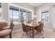 Bright dining area with tile floors, table and seating for four, and large windows overlooking the property at 2189 Old Dixie Hwy, Ormond Beach, FL 32174