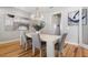 Dining room area with designer lighting, modern furniture, and wood flooring at 2189 Old Dixie Hwy, Ormond Beach, FL 32174