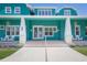 Inviting front porch with seating area, stylish lighting, and attractive facade at 2189 Old Dixie Hwy, Ormond Beach, FL 32174