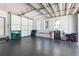 Spacious garage with an epoxy floor, storage cabinets, a second garage door, and plenty of natural light at 2189 Old Dixie Hwy, Ormond Beach, FL 32174