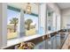 Gourmet kitchen with modern light fixture, granite counters, built in cooktop and views of the intercoastal waterway at 2189 Old Dixie Hwy, Ormond Beach, FL 32174