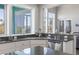 Bright kitchen featuring granite countertops, stainless steel dishwasher, and an exterior view at 2189 Old Dixie Hwy, Ormond Beach, FL 32174