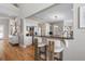 Bright kitchen featuring a breakfast bar with seating, stainless steel appliances, and light wood flooring at 2189 Old Dixie Hwy, Ormond Beach, FL 32174