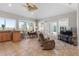 Bright living room featuring large windows, vaulted ceiling, breakfast bar, dining, and comfortable seating at 2189 Old Dixie Hwy, Ormond Beach, FL 32174