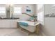 View of the claw foot tub in the main bathroom, situated near a large window with plantation shutters at 2189 Old Dixie Hwy, Ormond Beach, FL 32174