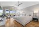 Bright main bedroom boasts vaulted ceiling, balcony access and modern ceiling fan at 2189 Old Dixie Hwy, Ormond Beach, FL 32174