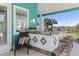Outdoor kitchen with seating, sink, grill, and counterspace with a view of the landscape at 2189 Old Dixie Hwy, Ormond Beach, FL 32174