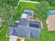 Aerial view of the home showcasing the expansive backyard and screened-in pool at 27 Winding Creek Way, Ormond Beach, FL 32174