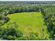 Aerial view of the community field perfect for sports and outdoor activities at 27 Winding Creek Way, Ormond Beach, FL 32174