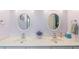Bathroom featuring double sinks, white cabinets, and modern fixtures at 27 Winding Creek Way, Ormond Beach, FL 32174