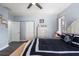 Bedroom featuring luxury vinyl flooring and access to a closet and ensuite bathroom at 27 Winding Creek Way, Ormond Beach, FL 32174