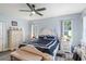 Bedroom featuring luxury vinyl flooring, ceiling fan, and ample natural light at 27 Winding Creek Way, Ormond Beach, FL 32174