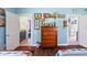 View of bedroom showing a dresser and doorway to ensuite bathroom at 27 Winding Creek Way, Ormond Beach, FL 32174