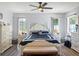Well-lit bedroom features a ceiling fan and beautiful decor for a relaxing atmosphere at 27 Winding Creek Way, Ormond Beach, FL 32174