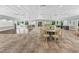 Well-lit event space with tables, chairs, and a dance floor for gatherings at 27 Winding Creek Way, Ormond Beach, FL 32174