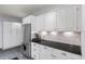 Kitchen with black countertop, stainless steel refrigerator at 27 Winding Creek Way, Ormond Beach, FL 32174