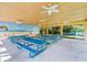 Open pavilion area with picnic tables, ceiling fans, and a charming mural at 27 Winding Creek Way, Ormond Beach, FL 32174