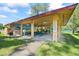 Community pavilion with picnic tables, a mural, and BBQ grill area at 27 Winding Creek Way, Ormond Beach, FL 32174