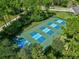 Aerial view of multiple pickleball courts, highlighting community recreational facilities and a vibrant active lifestyle at 27 Winding Creek Way, Ormond Beach, FL 32174