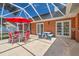 Outdoor patio featuring dining and picnic table with convenient access to the house at 27 Winding Creek Way, Ormond Beach, FL 32174