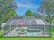 The screened-in pool has an attached spa, perfect for enjoying the outdoors and the beautiful weather at 27 Winding Creek Way, Ormond Beach, FL 32174