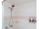 Clean shower featuring updated shower head and convenient dispensers against neutral tiling at 27 Winding Creek Way, Ormond Beach, FL 32174