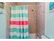 Bathtub and shower featuring decorative shower curtain and tile surround at 27 Winding Creek Way, Ormond Beach, FL 32174