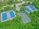 Aerial view of tennis and basketball courts within the community, showcasing recreational amenities for residents at 27 Winding Creek Way, Ormond Beach, FL 32174