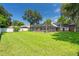 Beautiful property featuring a large green lawn with established trees at 27 Winding Creek Way, Ormond Beach, FL 32174